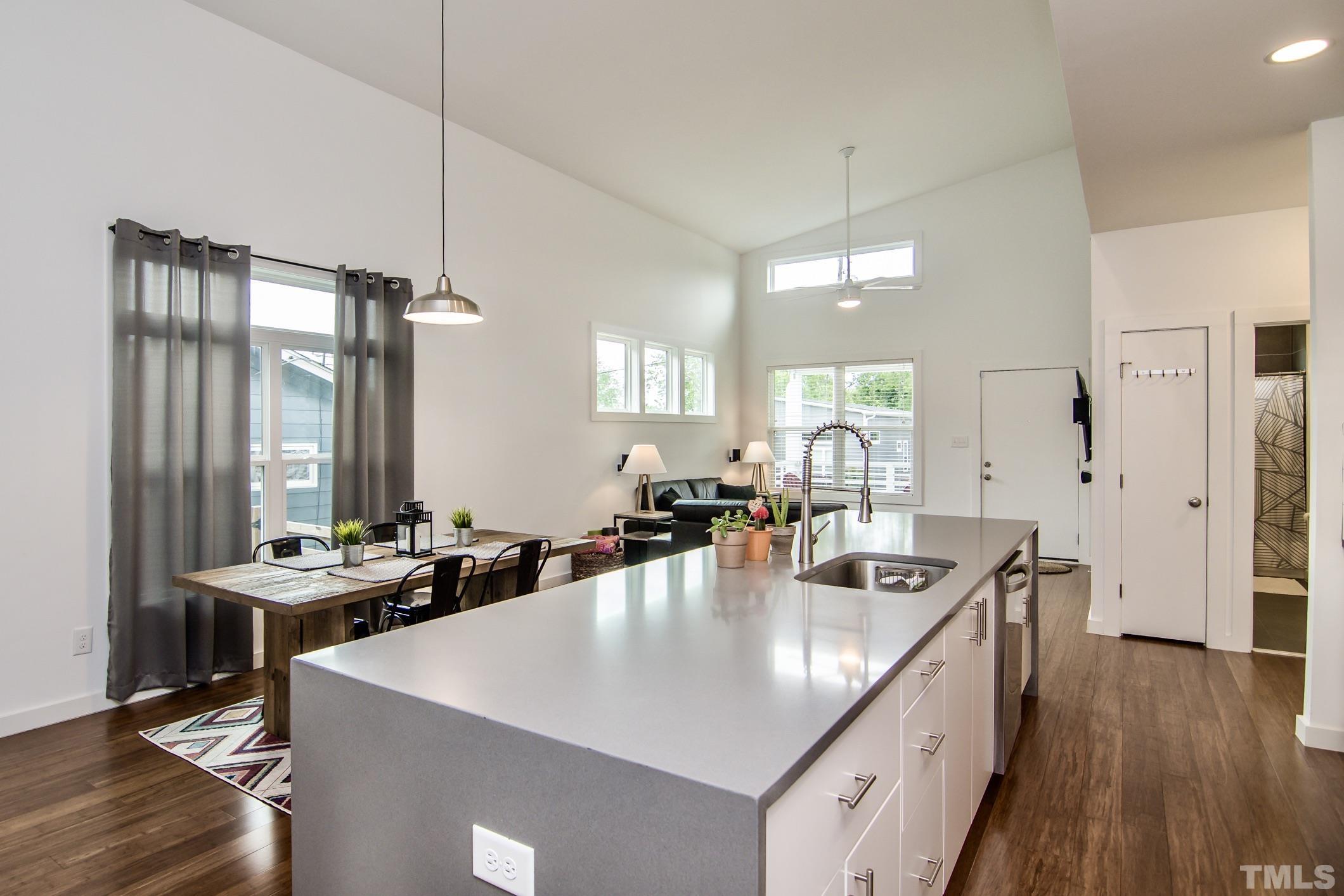 1309 South East Street Raleigh, NC 27601 - Photo 13 of 29 a kitchen with center island table and chairs