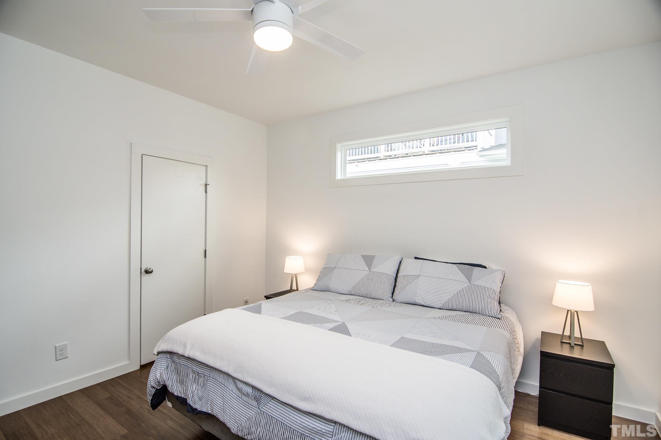1309 South East Street Raleigh, NC 27601 - Photo 15 of 29 a bedroom with a bed and a window