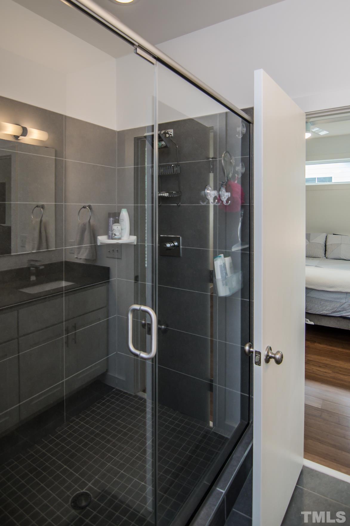 1309 South East Street Raleigh, NC 27601 - Photo 17 of 29 a bathroom with a shower and a sink