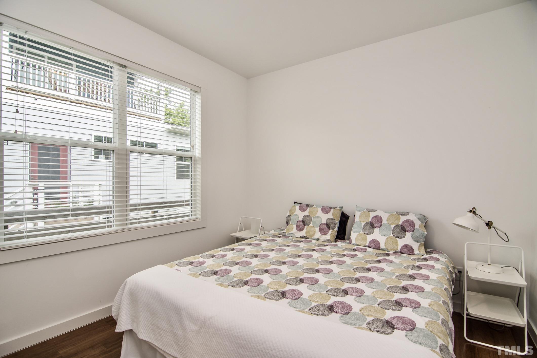 1309 South East Street Raleigh, NC 27601 - Photo 22 of 29 a bedroom with a bed and a window