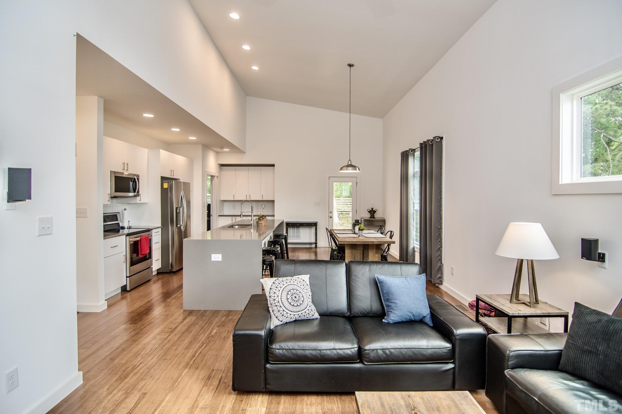 1309 South East Street Raleigh, NC 27601 - Photo 6 of 29 a living room with furniture and a wooden floor