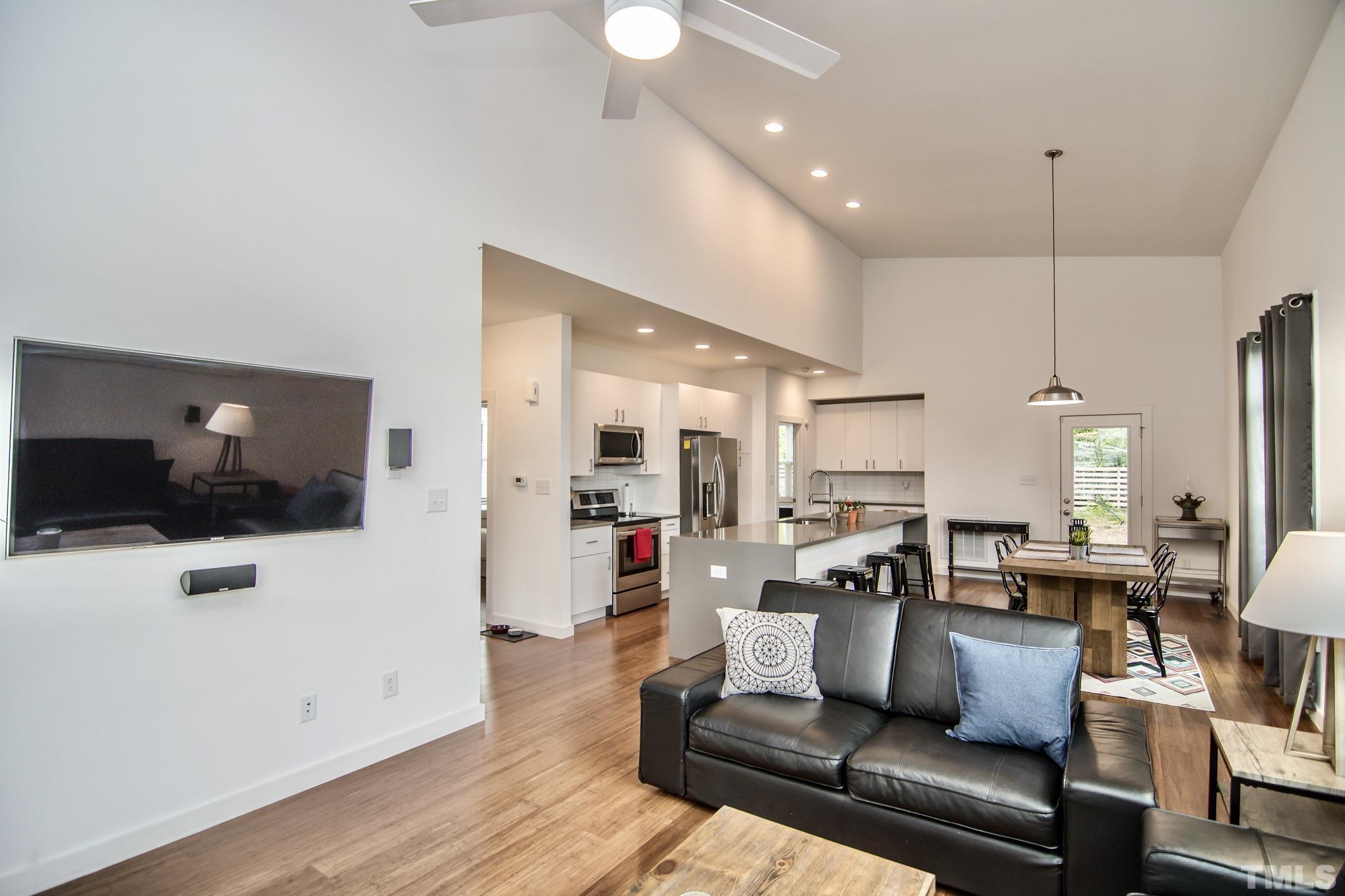 1309 South East Street Raleigh, NC 27601 - Photo 7 of 29 a living room with furniture and a flat screen tv