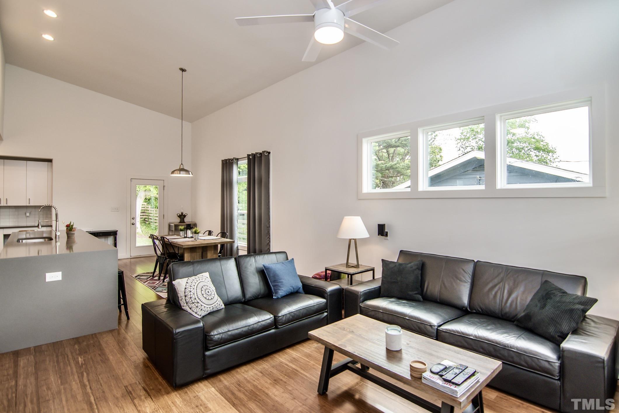 1309 South East Street Raleigh, NC 27601 - Photo 9 of 29 a living room with furniture and a large window