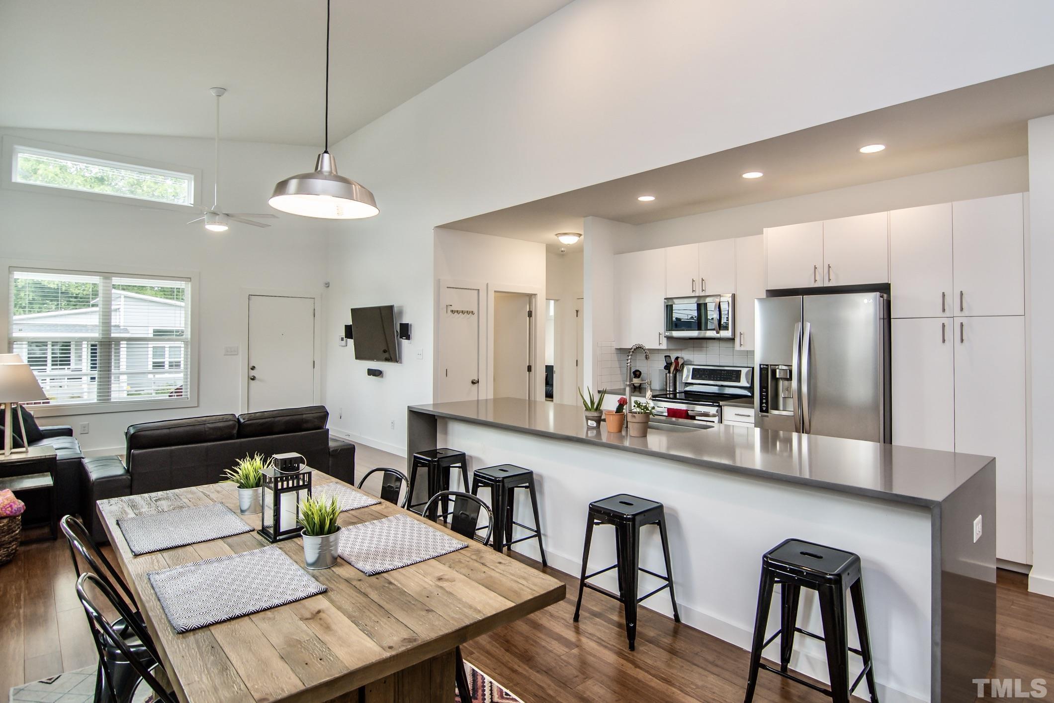 1309 South East Street Raleigh, NC 27601 - Photo 10 of 29 a large kitchen with a table and chairs