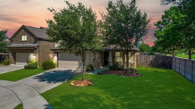 a view of a backyard with table and chairs and wooden fence