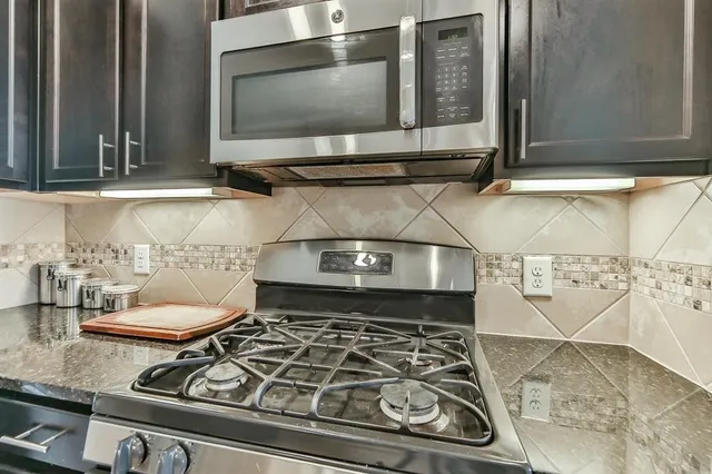 a kitchen with a table and chairs in it