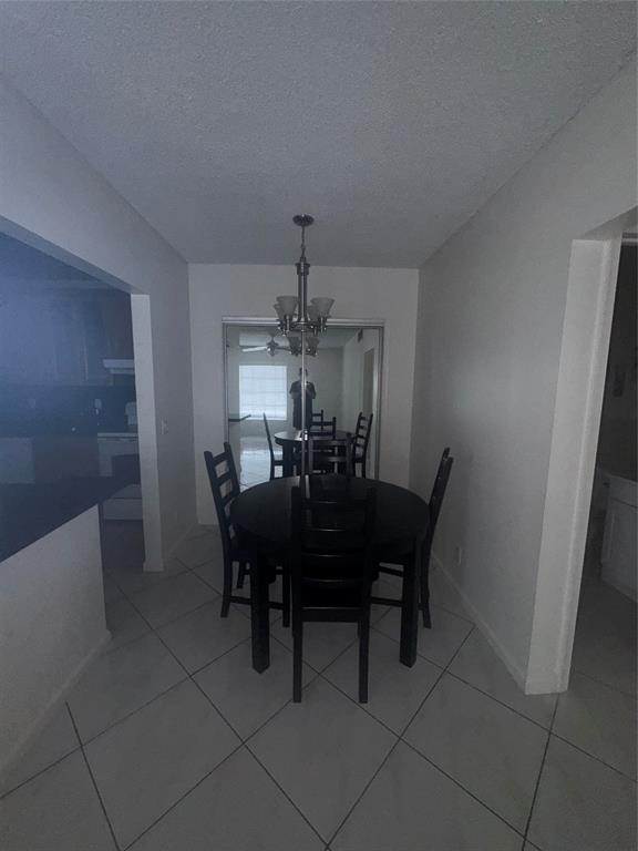 2220 Northeast 68th Street, Unit 1031 Fort Lauderdale, FL 33308 - Photo 3 of 12 a view of a dining room with furniture