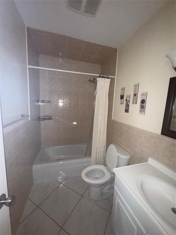 2220 Northeast 68th Street, Unit 1031 Fort Lauderdale, FL 33308 - Photo 9 of 12 a bathroom with a sink and a shower