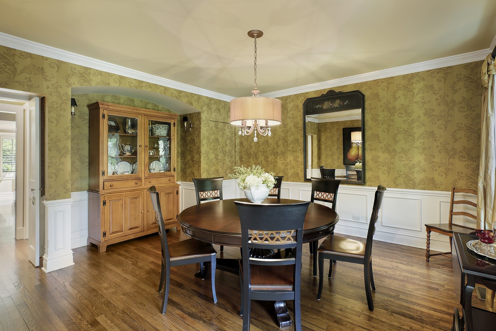 579 Hill Terrace Winnetka, IL 60093 - Photo 7 of 31 a view of a dining room with furniture window and wooden floor