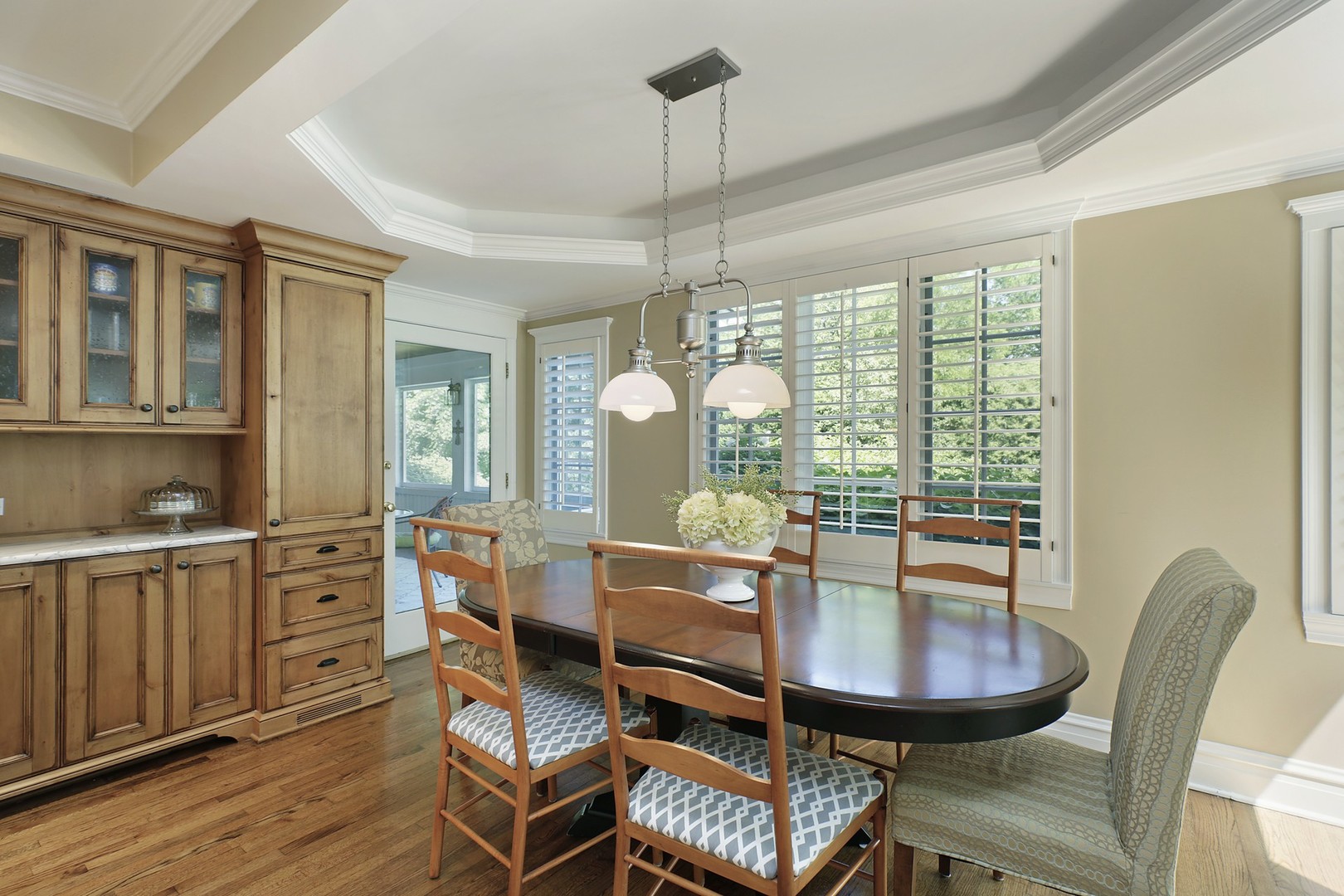 579 Hill Terrace Winnetka, IL 60093 - Photo 9 of 31 a view of a dining room with furniture window and wooden floor