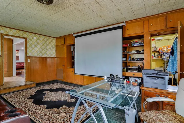 a view of a house with backyard porch and sitting area