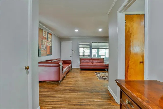 a living room with furniture rug and window