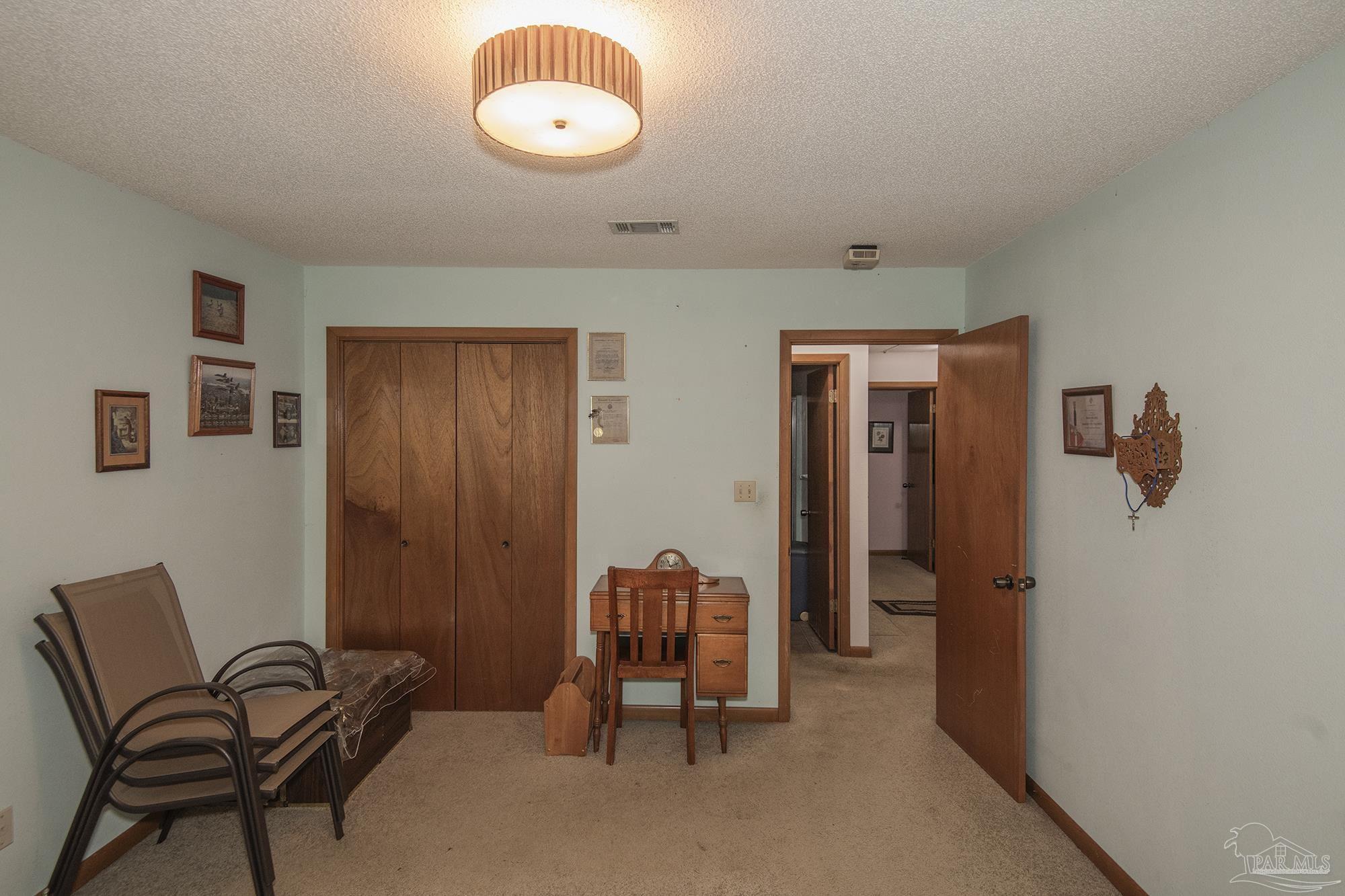 1210 Goldenrod Road Cantonment, FL 32533 - Photo 30 of 50 a view of a room with gym equipment