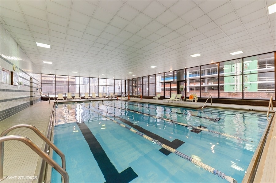 Undisclosed Address Chicago, IL 60611 - Photo 11 of 19 a view of a swimming pool and a balcony