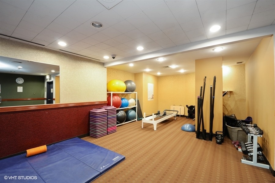 Undisclosed Address Chicago, IL 60611 - Photo 17 of 19 a room with furniture