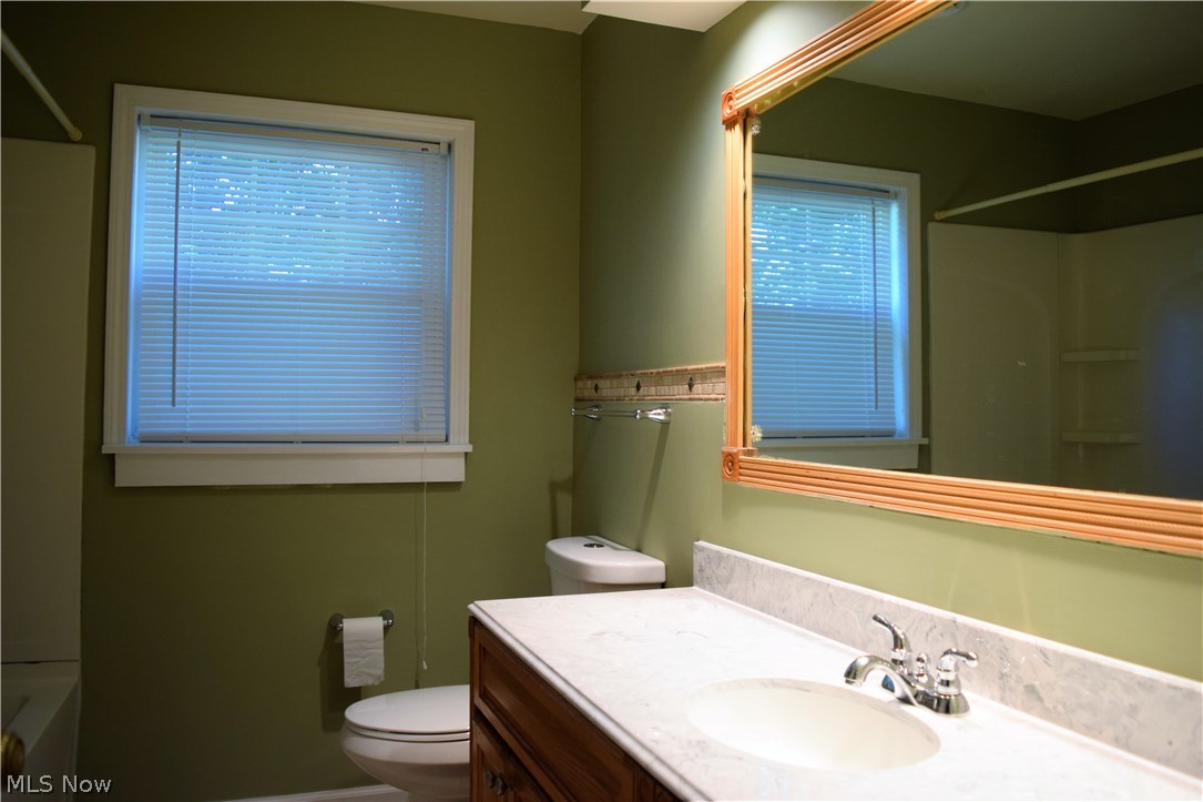 616 Everhard Road Southwest North Canton, OH 44709 - Photo 10 of 18 Updated bath offers a shower/tub combo and large 5ft vanity.
