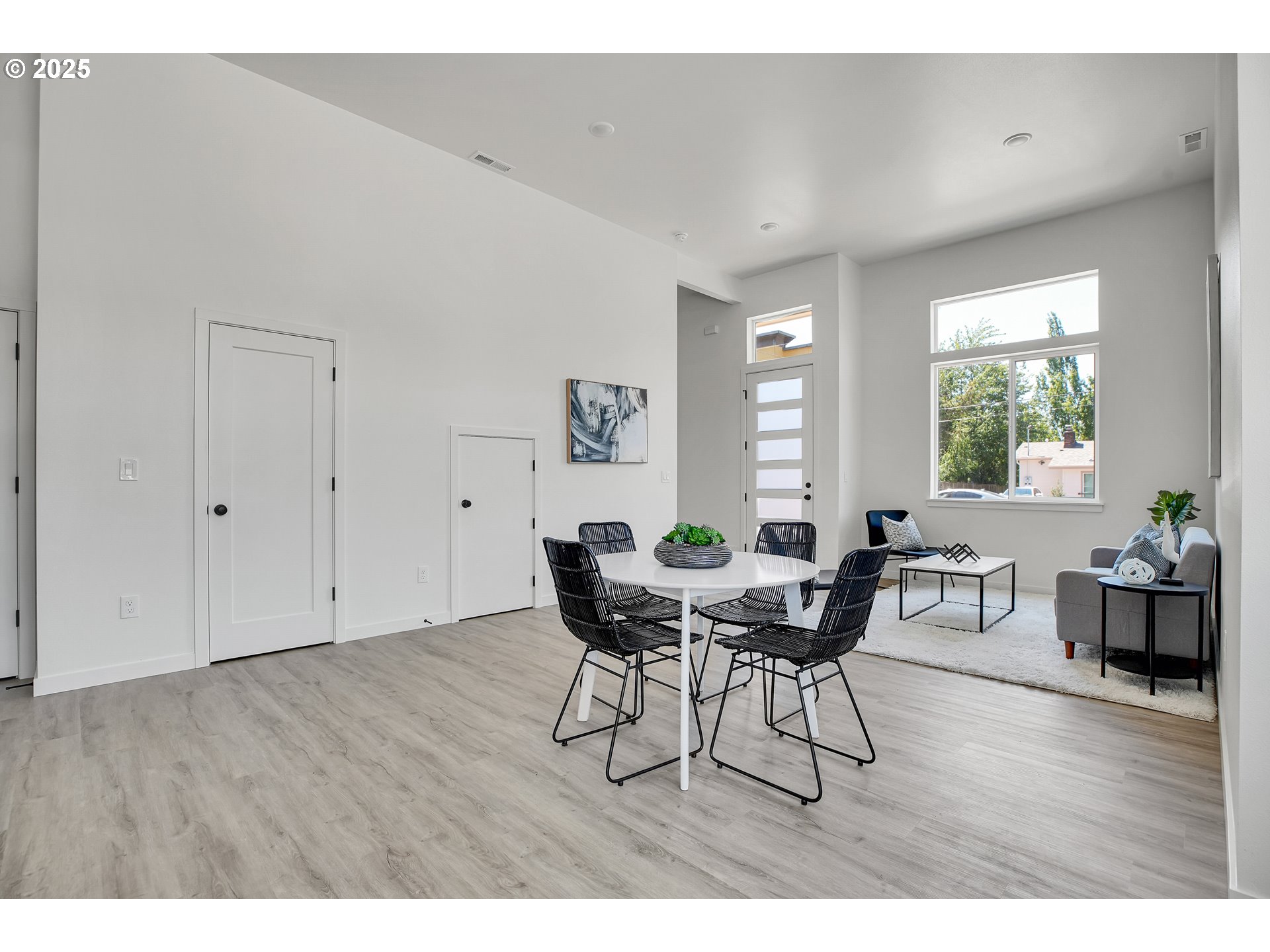 94 Northeast 148th Avenue, Unit 1 Portland, OR 97230 - Photo 4 of 39 a view of a dining room with furniture and wooden floor