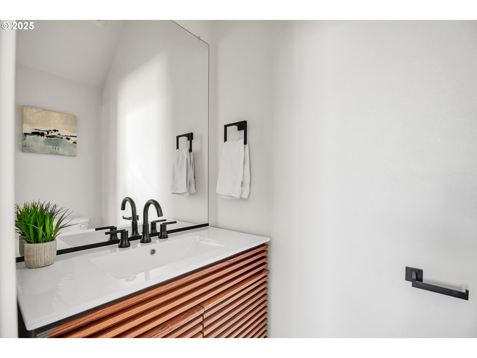 94 Northeast 148th Avenue, Unit 1 Portland, OR 97230 - Photo 8 of 39 a bathroom with a sink and a mirror