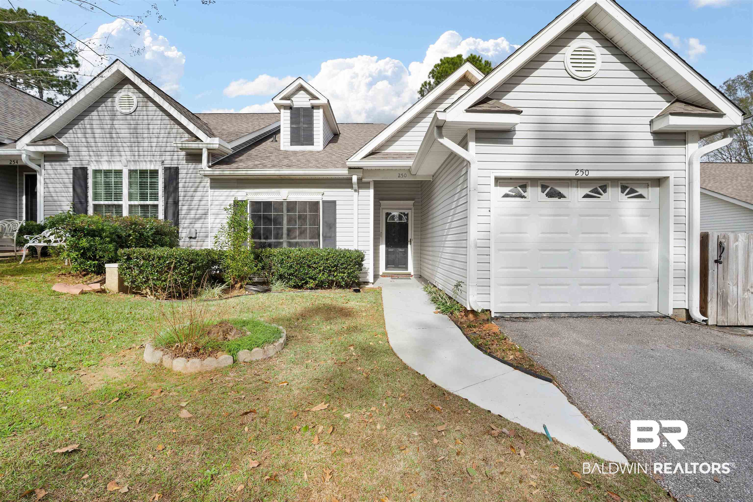 250 North Spring Lake Drive Mobile, AL 36695 - Photo 1 of 29 Ranch-style house with a front yard, roof with shingles, an attached garage, and driveway