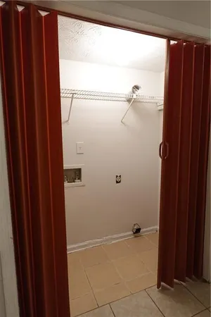 a bathroom with a shower and a sink