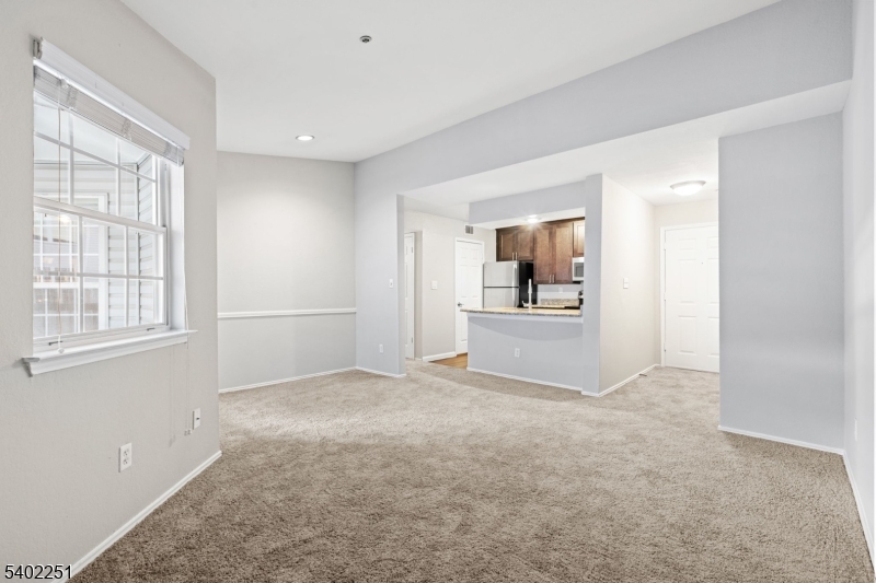 690 Route 23 Wayne Nj 07470, Unit R1 Wayne, NJ 07470 - Photo 3 of 8 a view of an empty room with a window