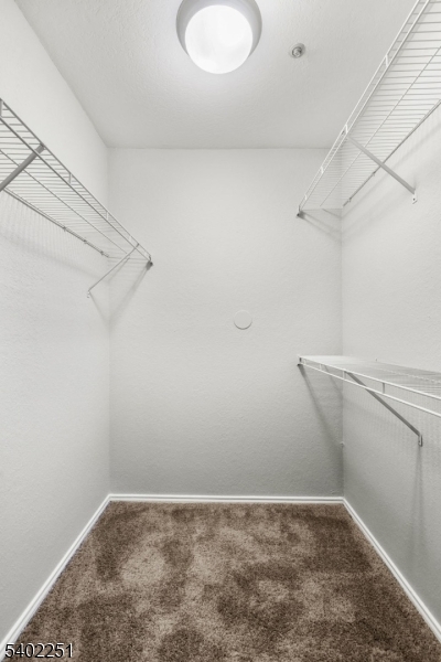 690 Route 23 Wayne Nj 07470, Unit R1 Wayne, NJ 07470 - Photo 7 of 8 a view of a room with racks on the wall