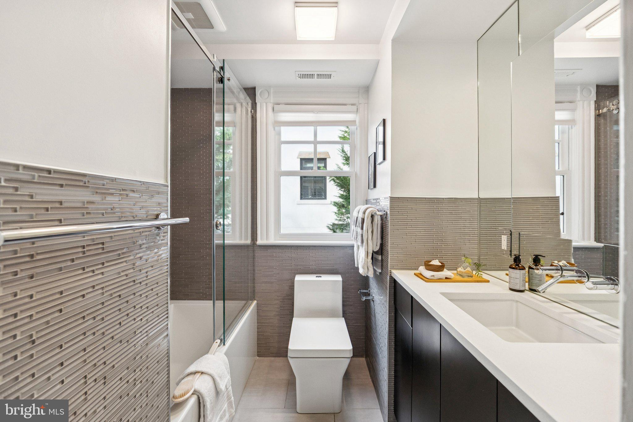 3200 44th Street Northwest Washington, DC 20016 - Photo 18 of 25 a bathroom with a sink a toilet and shower