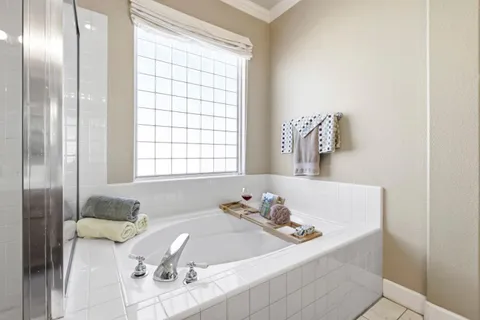 a bedroom with a bed and a mirror