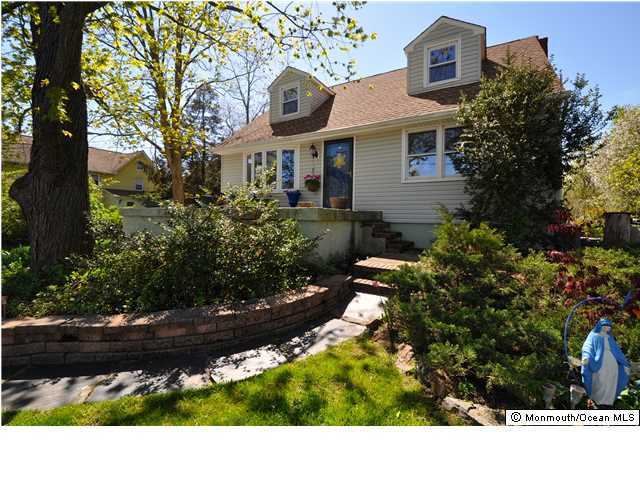 67 Middlesex Road Matawan, NJ 07747 - Photo 1 of 3 a view of a house with a yard and garden