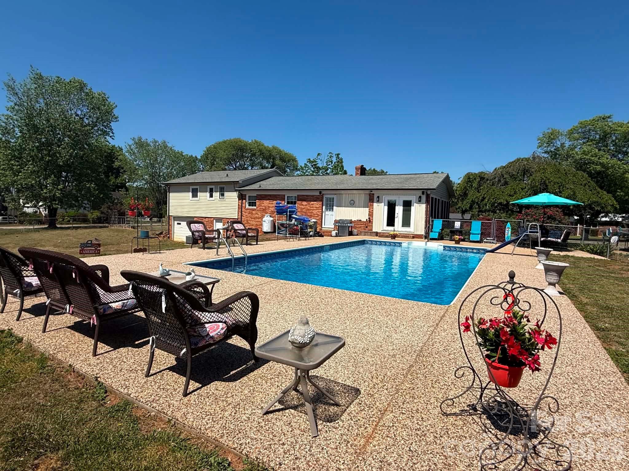 2121 Union Grove Road Lenoir, NC 28645 - Photo 35 of 38 a view of a swimming pool with outdoor seating