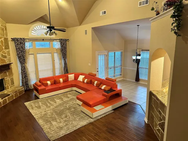 a bedroom with a bed dresser and a window