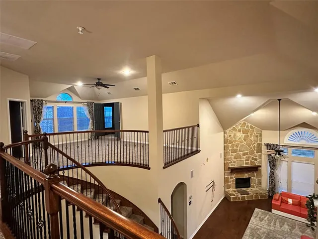 a view of a livingroom with furniture and staircase