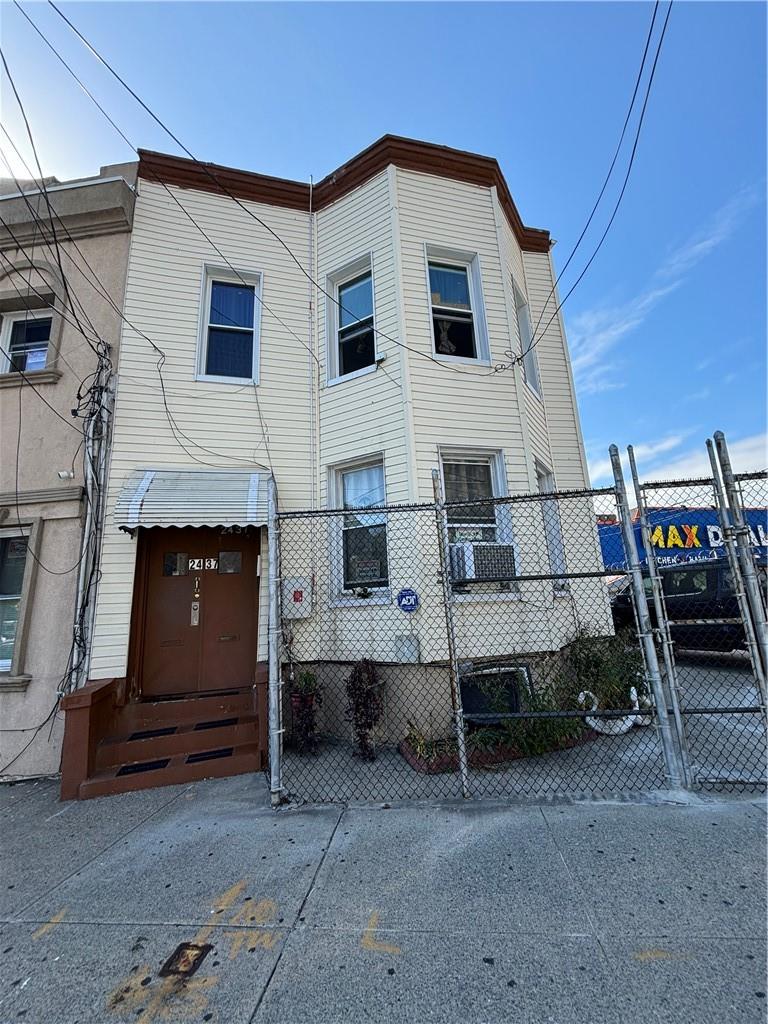 a front view of a house with parking