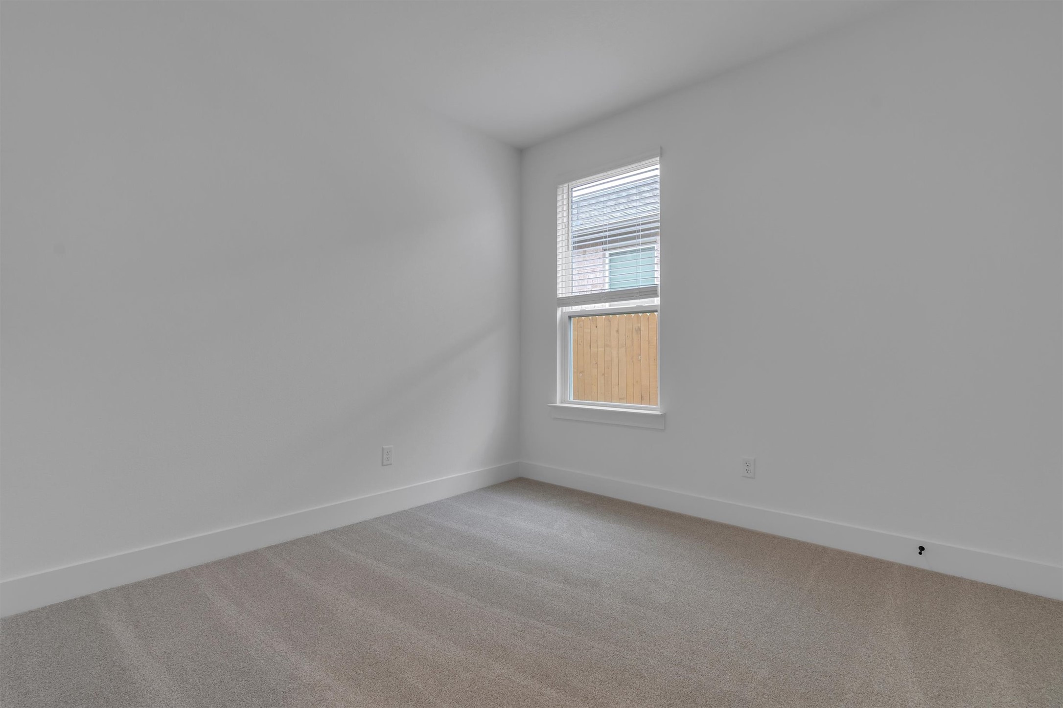368 Bridge Deck Loop Kyle, TX 78640 - Photo 20 of 40 Empty room with light colored carpet and baseboards