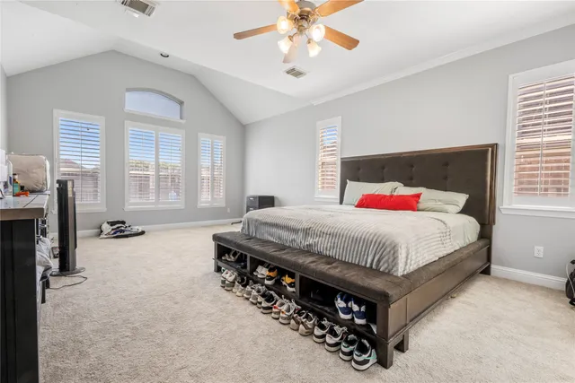 a bed room with a bed and a chandelier