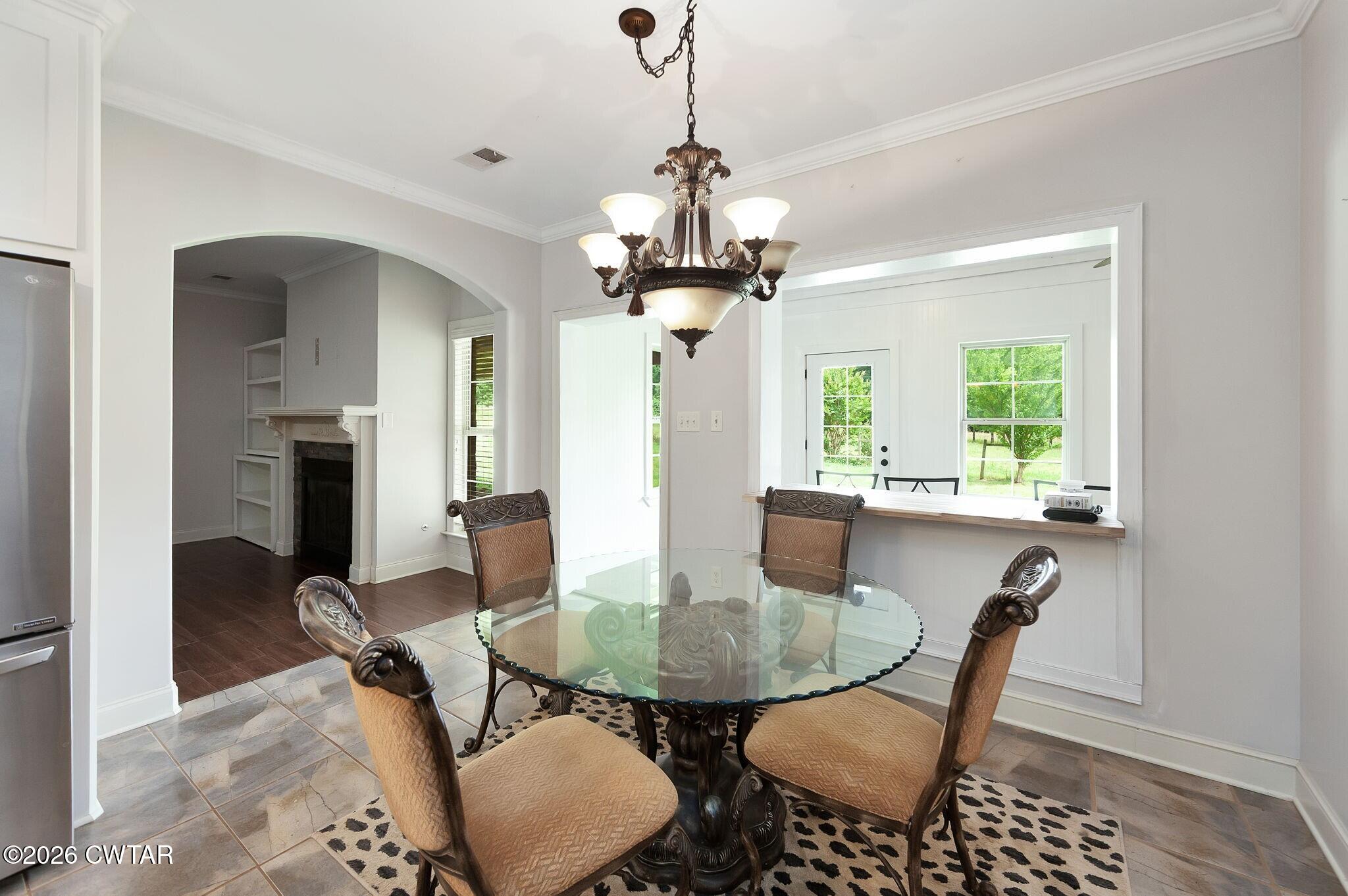 4080 Beech Bluff Road Beech Bluff, TN 38313 - Photo 18 of 41 a view of a dining room with furniture and window