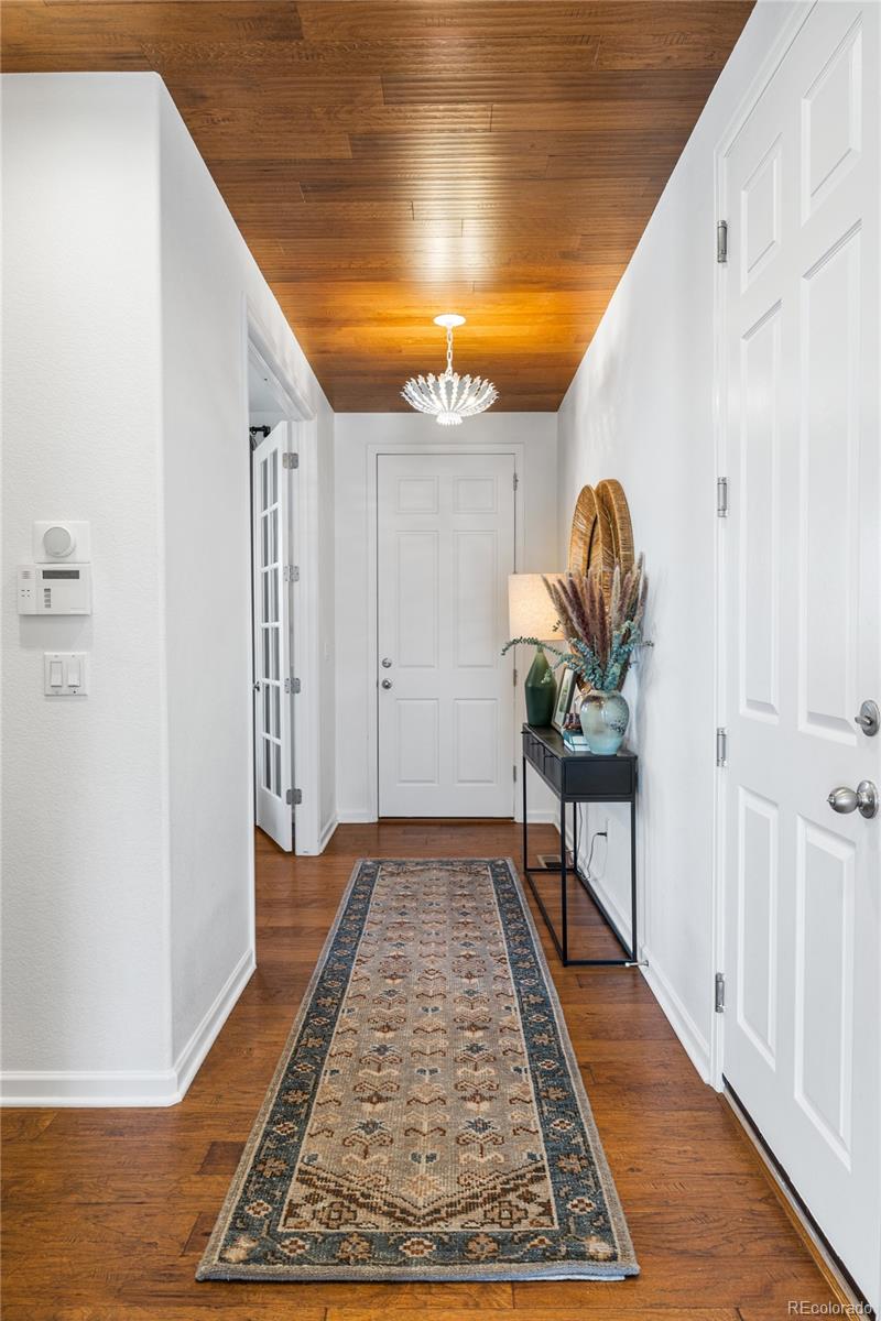 10451 Meadowleaf Way Highlands Ranch, CO 80126 - Photo 11 of 39 a hallway with wooden floor