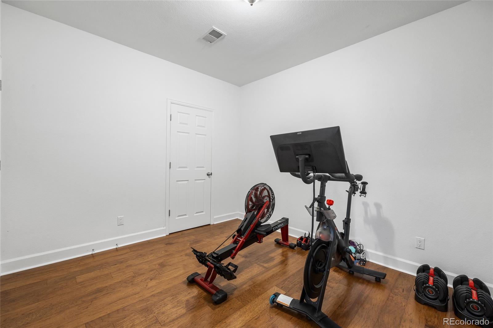 10451 Meadowleaf Way Highlands Ranch, CO 80126 - Photo 28 of 39 a view of a room with gym equipment