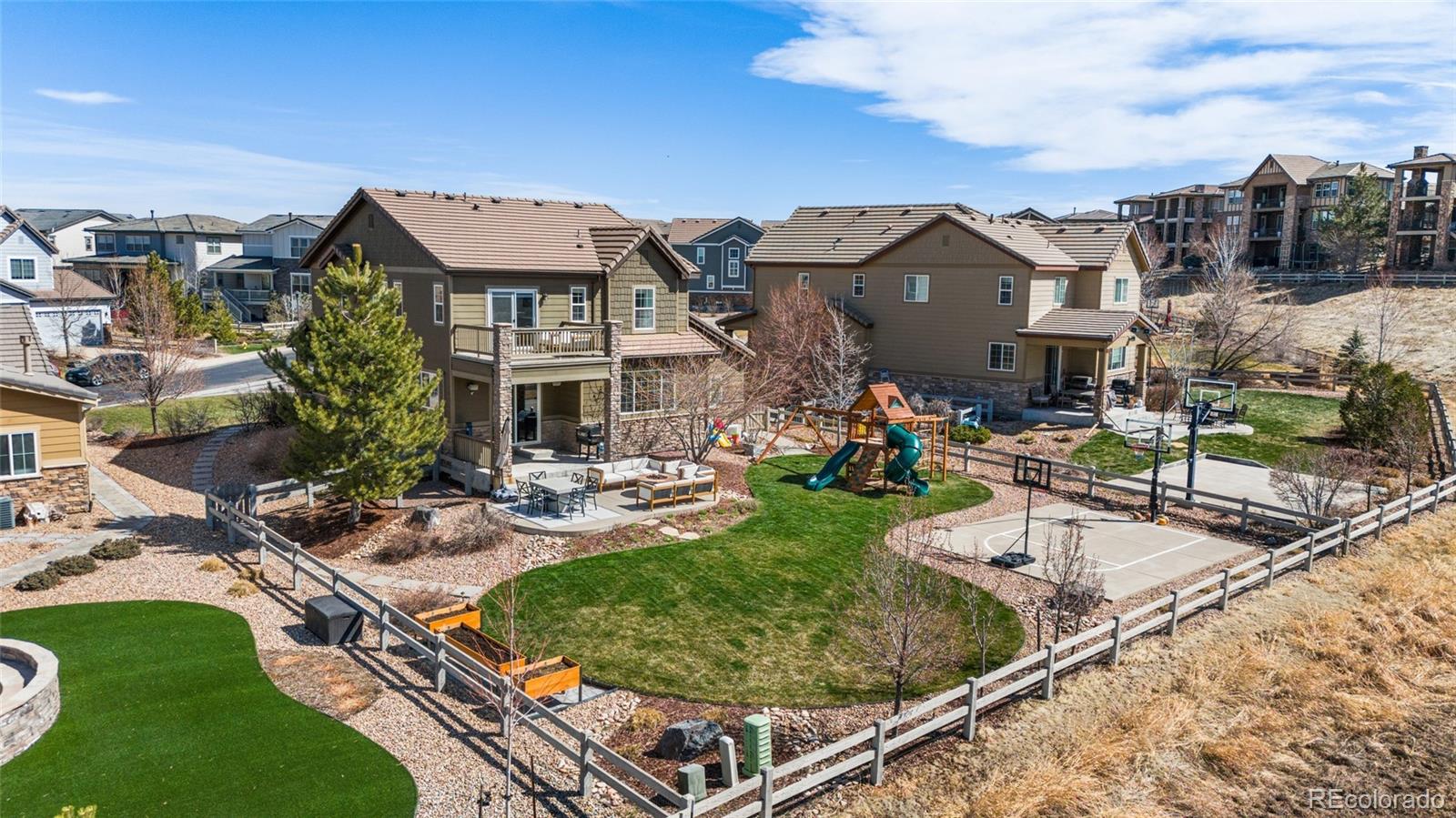 10451 Meadowleaf Way Highlands Ranch, CO 80126 - Photo 29 of 39 a view of a house with backyard and sitting area