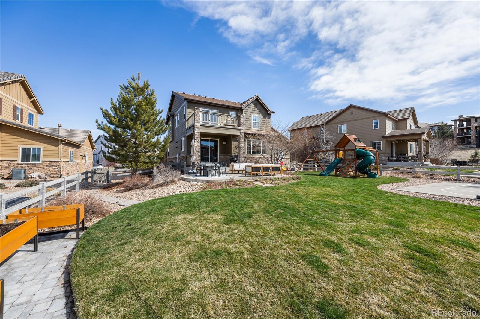 10451 Meadowleaf Way Highlands Ranch, CO 80126 - Photo 30 of 39 a view of a house with a swimming pool