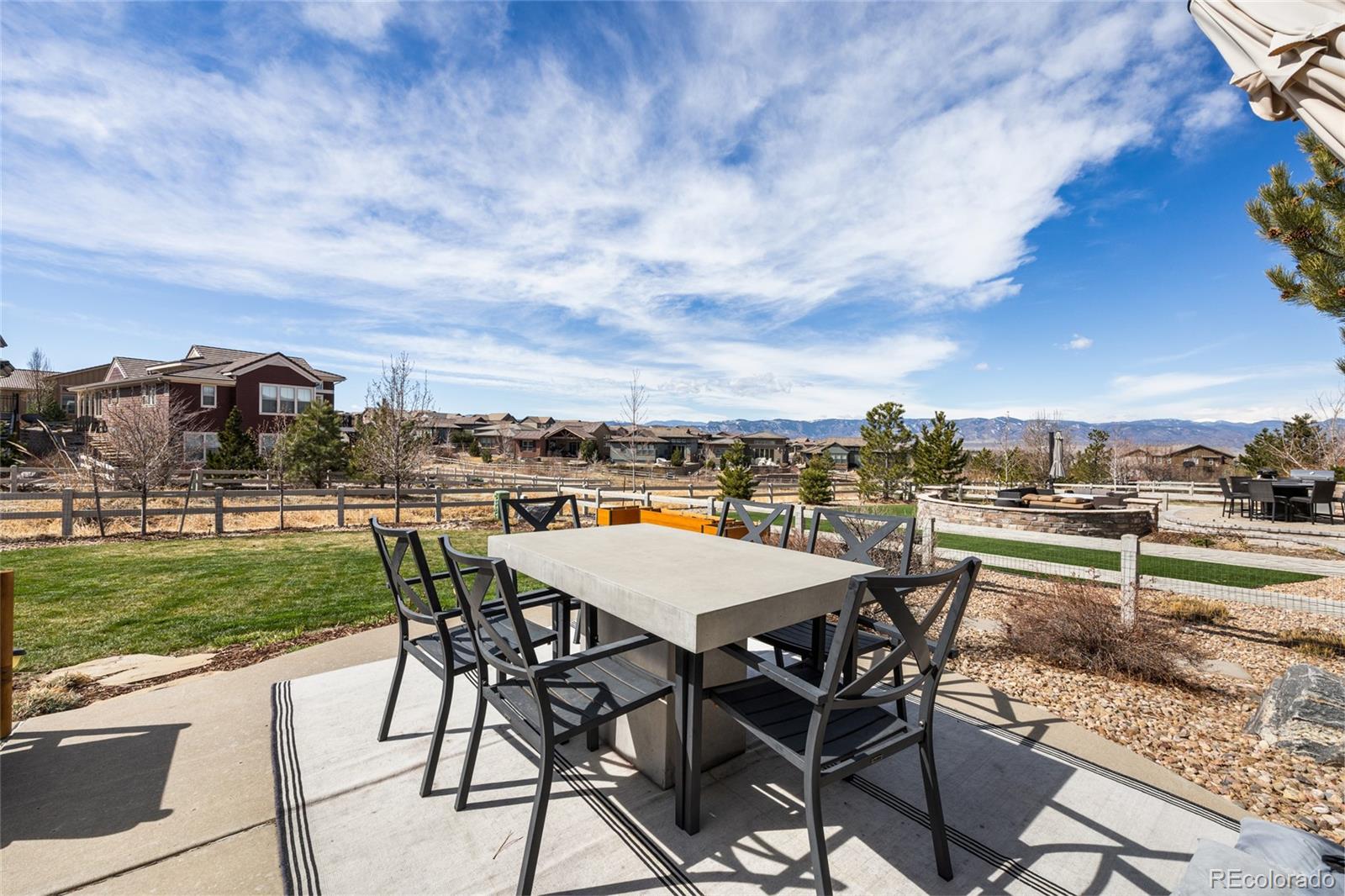 10451 Meadowleaf Way Highlands Ranch, CO 80126 - Photo 33 of 39 a view of a yard with table and chairs