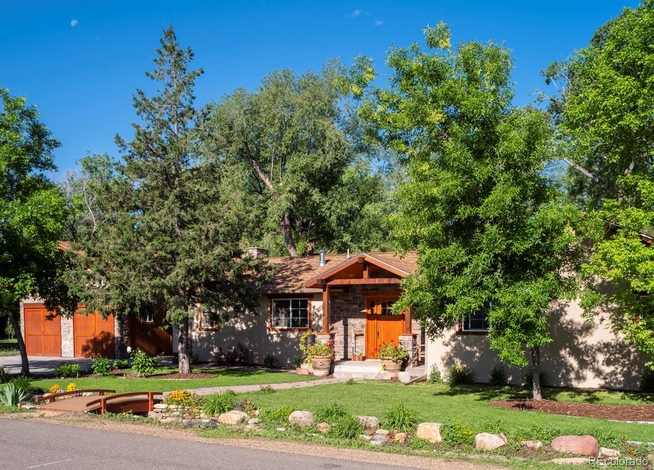 1085 Gapter Road Boulder, CO 80303 - Photo 2 of 24 a front view of a house with a yard