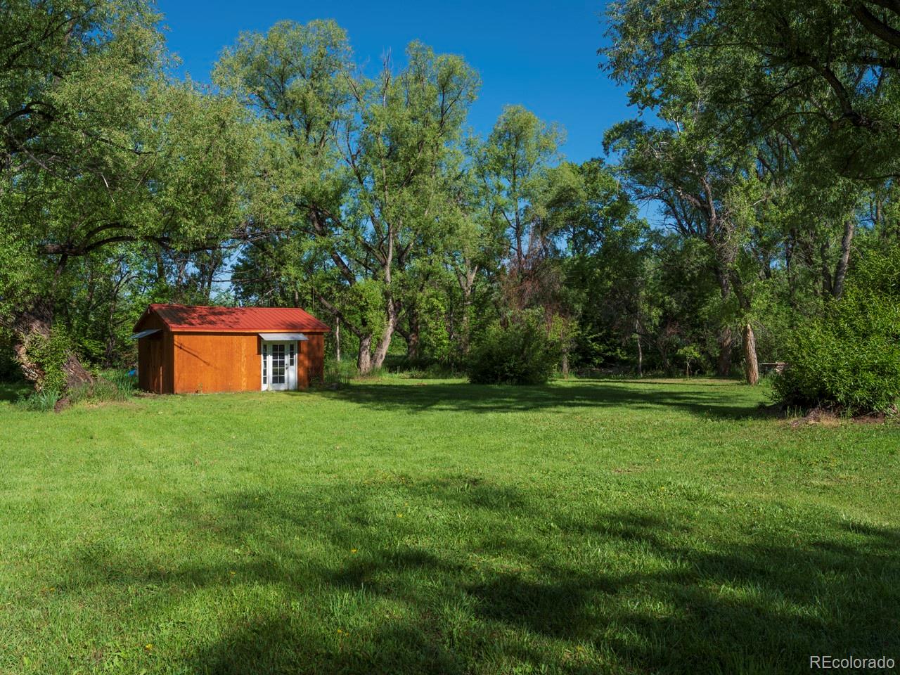 1085 Gapter Road Boulder, CO 80303 - Photo 21 of 24 a view of a tiny house with a yard