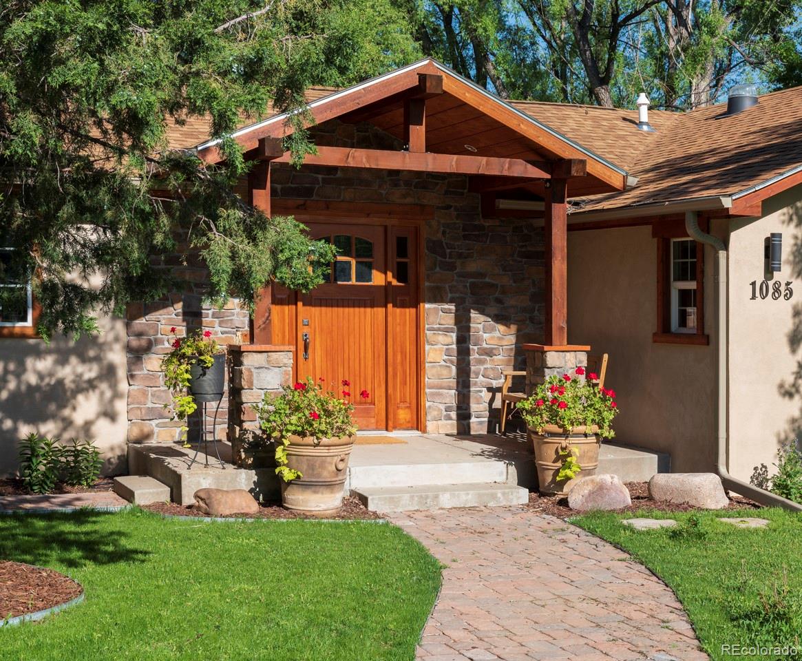1085 Gapter Road Boulder, CO 80303 - Photo 5 of 24 a front view of house with yard and outdoor seating