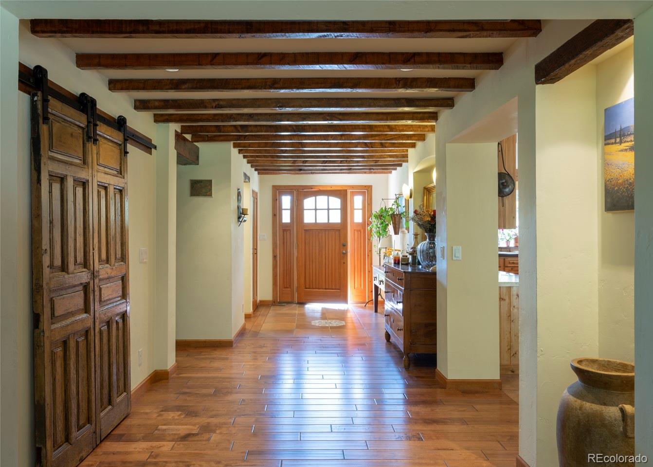 1085 Gapter Road Boulder, CO 80303 - Photo 6 of 24 a view of hallway with wooden floor and furniture