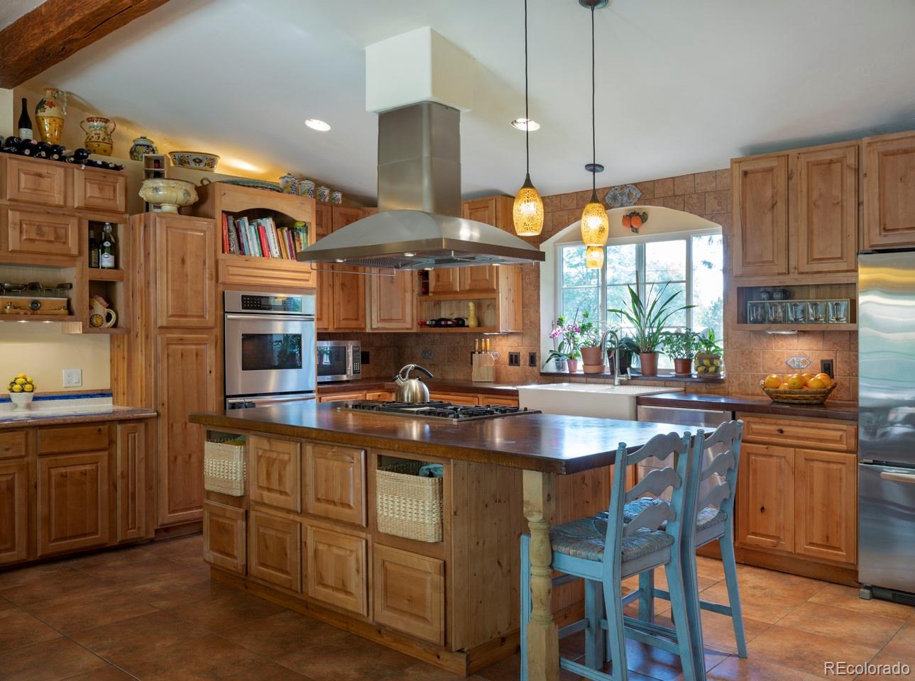1085 Gapter Road Boulder, CO 80303 - Photo 10 of 24 a kitchen with stainless steel appliances granite countertop a sink a stove and a refrigerator