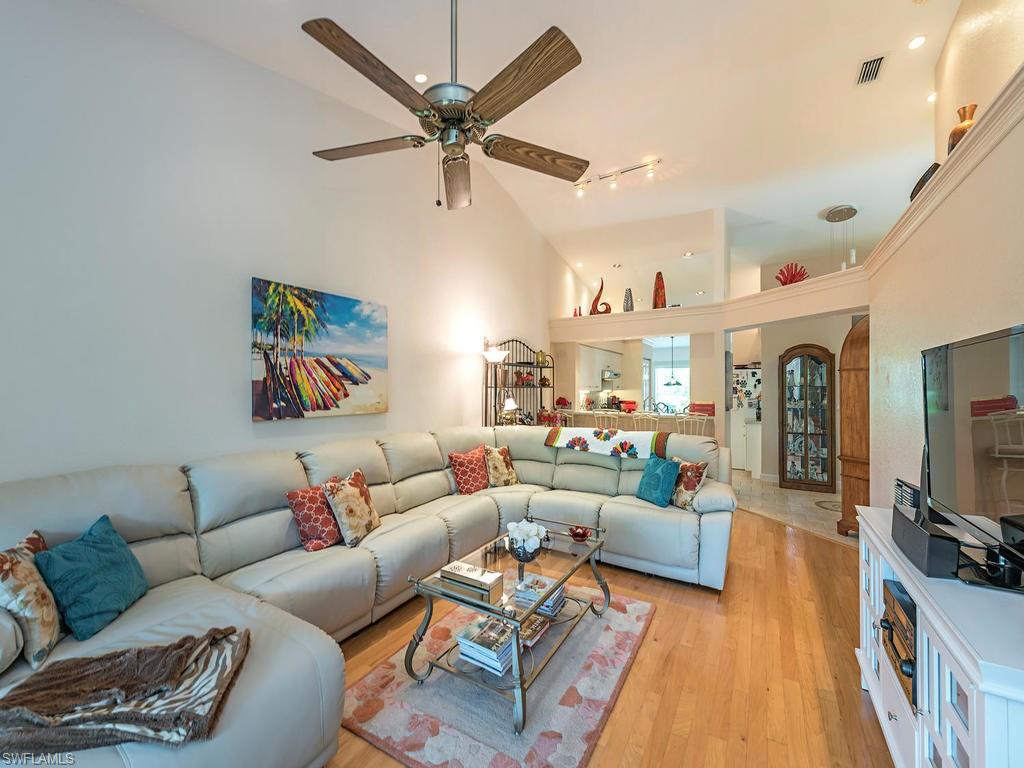 1827 West Crown Pointe Boulevard Naples, FL 34112 - Photo 3 of 12 a living room with furniture and a flat screen tv