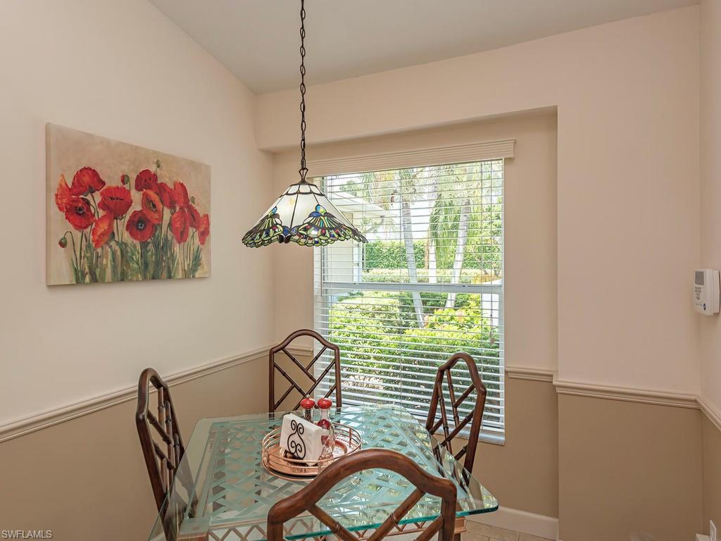 1827 West Crown Pointe Boulevard Naples, FL 34112 - Photo 6 of 12 a view of a dining room with furniture window and outside view