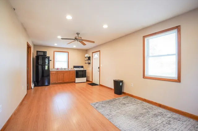 a view of a kitchen with a sink and a refrigerator