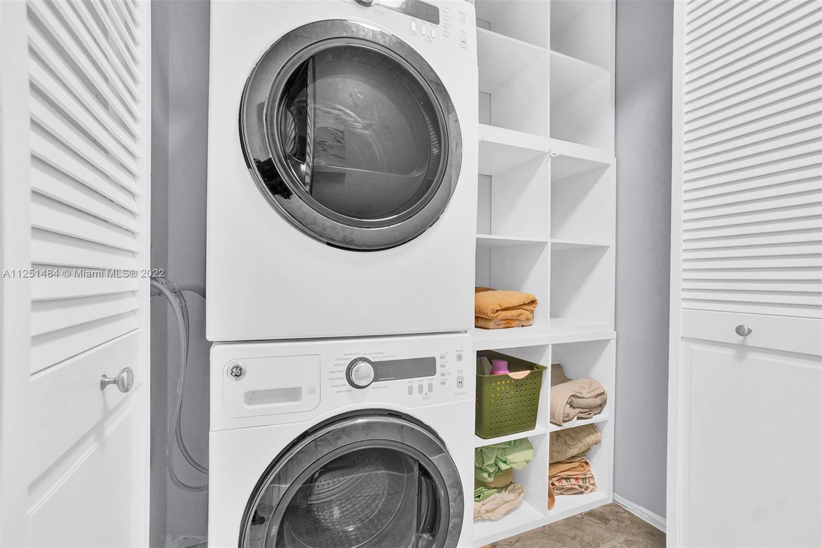 Whisper Walk Boca Raton, FL 33496 - Photo 12 of 17 a utility room with dryer and washer